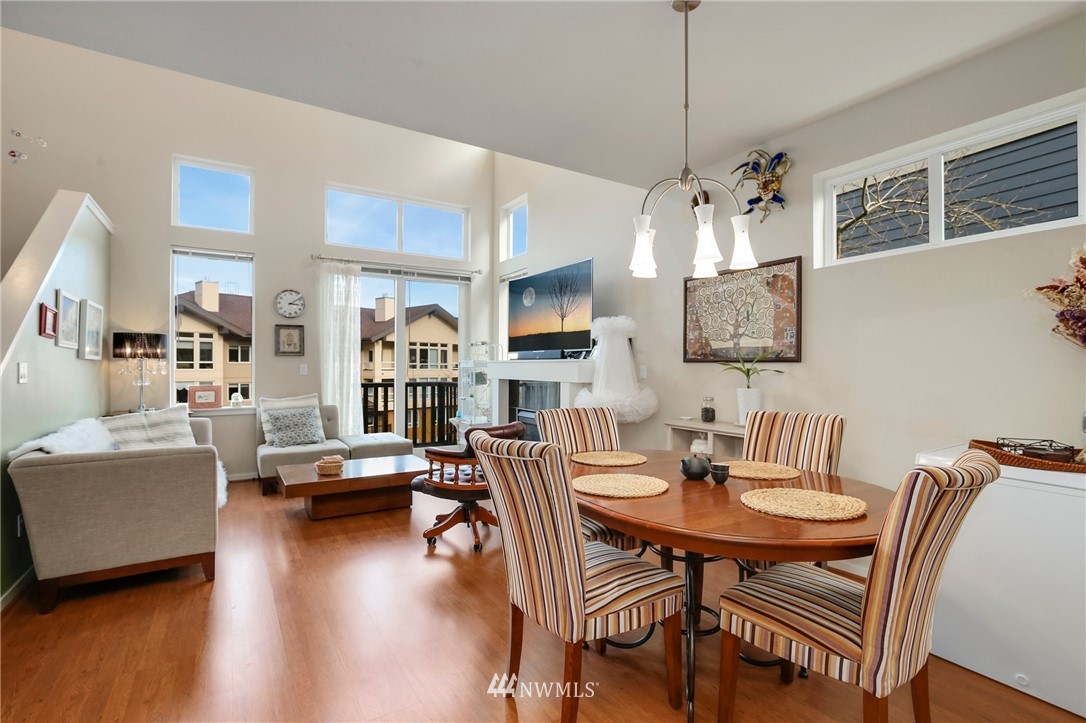 138 Cougar Ridge Road Northwest Issaquah, WA 98027 - Photo 8 of 27 a view of a dining room with furniture and wooden floor