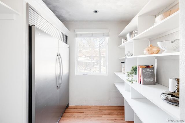 a kitchen with refrigerator and window