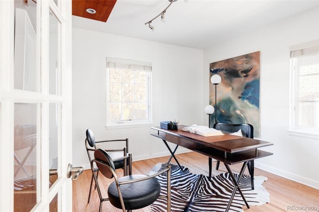 a work room with furniture and windows