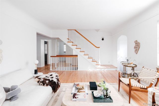 a bed room with a bed and a chair