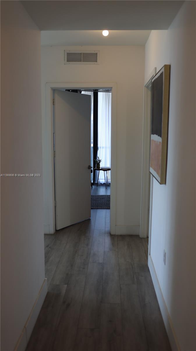 201 Southwest 17th Road, Unit 606 Miami, FL 33129 - Photo 16 of 37 an empty room with closet and windows