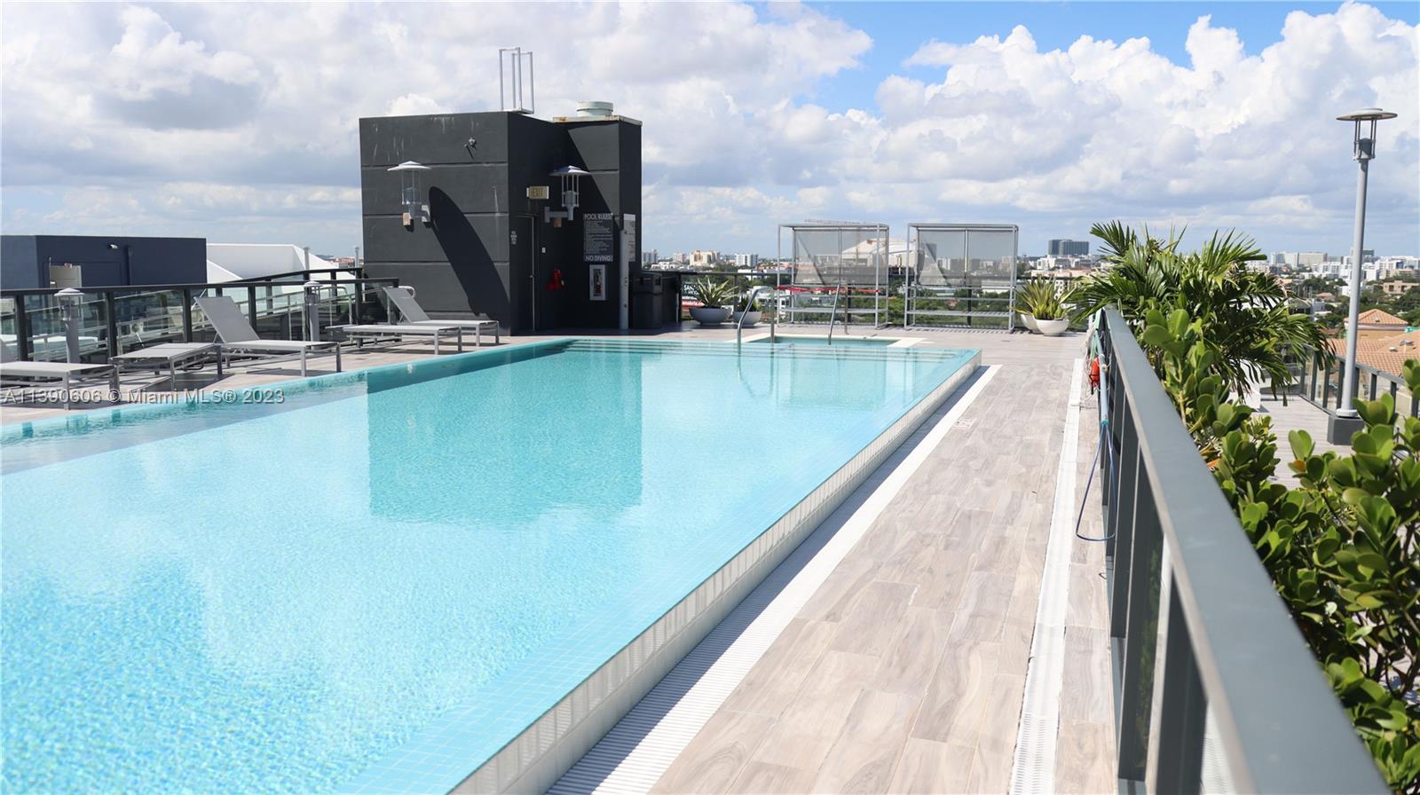 201 Southwest 17th Road, Unit 606 Miami, FL 33129 - Photo 24 of 37 a view of a lake with chairs