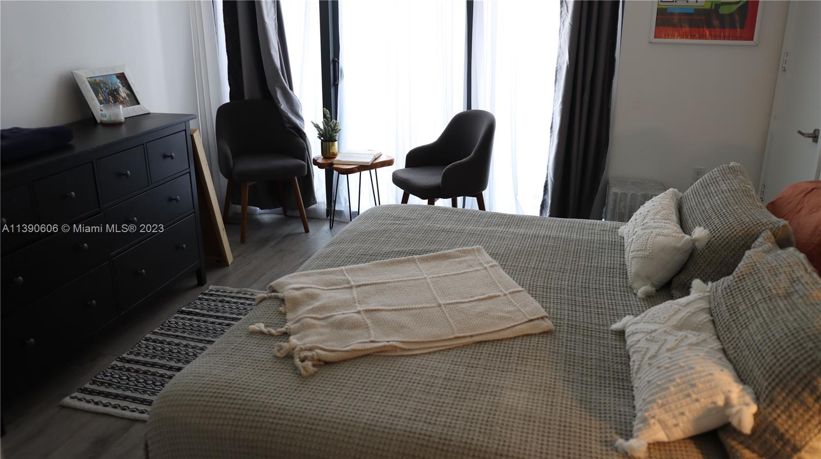 201 Southwest 17th Road, Unit 606 Miami, FL 33129 - Photo 8 of 37 a bedroom with furniture and natural light