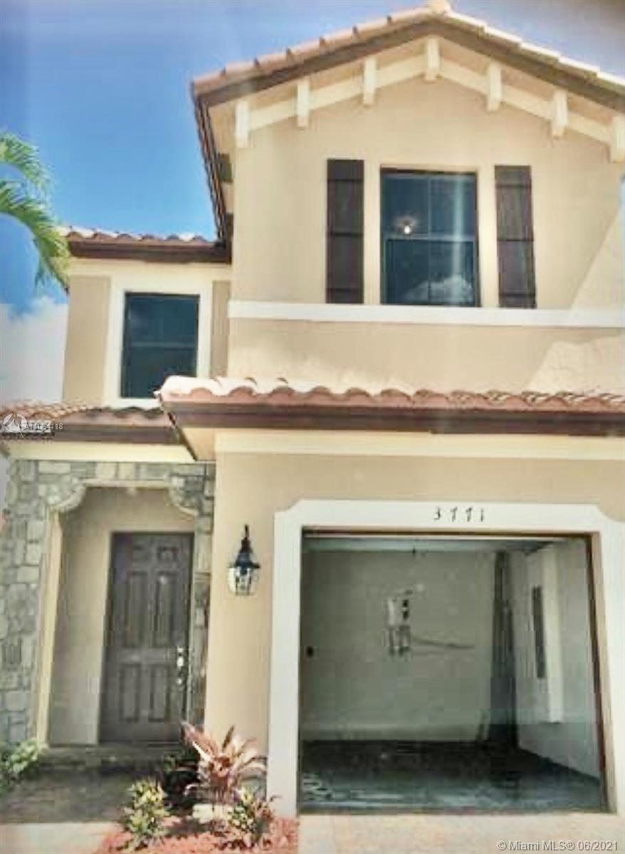 3771 Northeast 1st Street Homestead, FL 33033 - Photo 1 of 7 a front view of a house