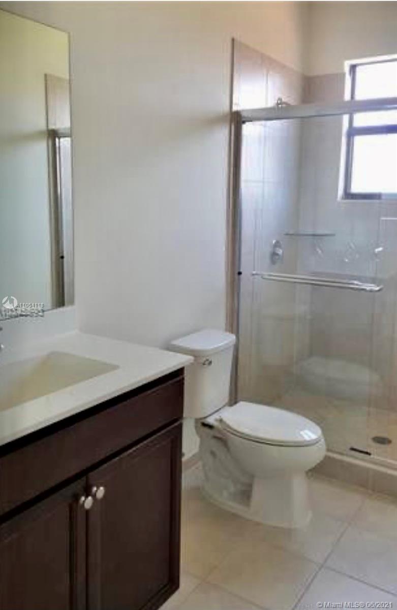 3771 Northeast 1st Street Homestead, FL 33033 - Photo 6 of 7 a bathroom with a sink toilet and shower