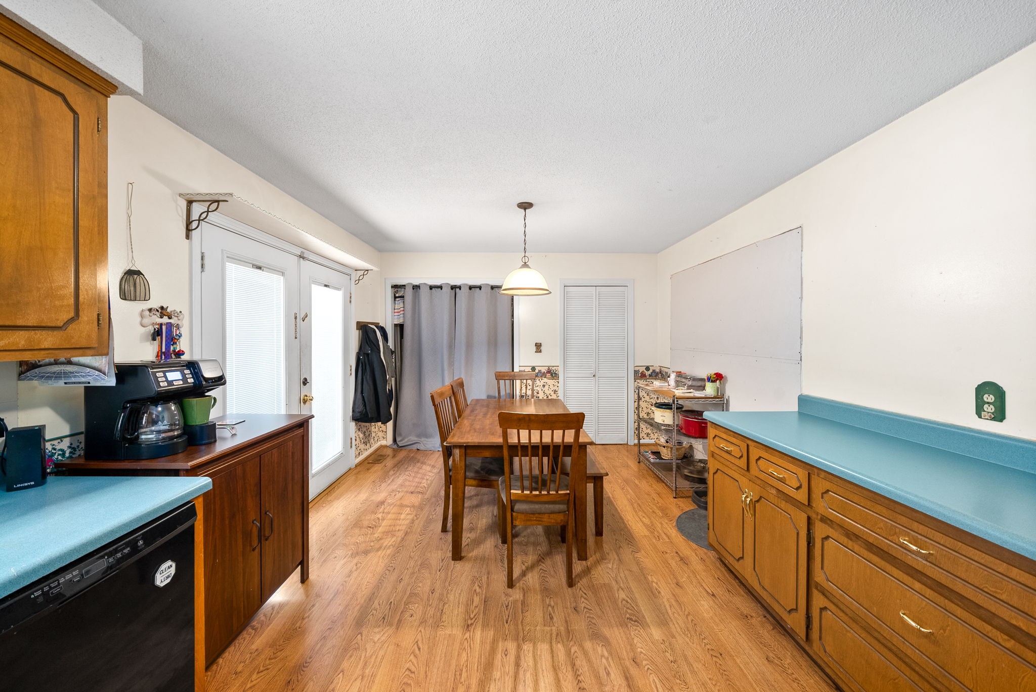 392 Dean Road Clarksville, TN 37040 - Photo 13 of 25 a kitchen with a table chairs and a wooden floor