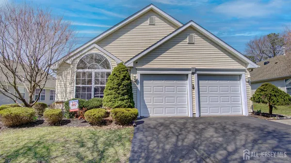a view of a house with a yard and garage
