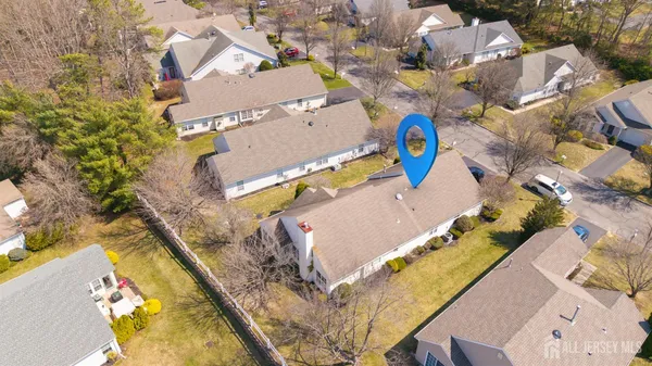 an aerial view of a house with a swimming pool