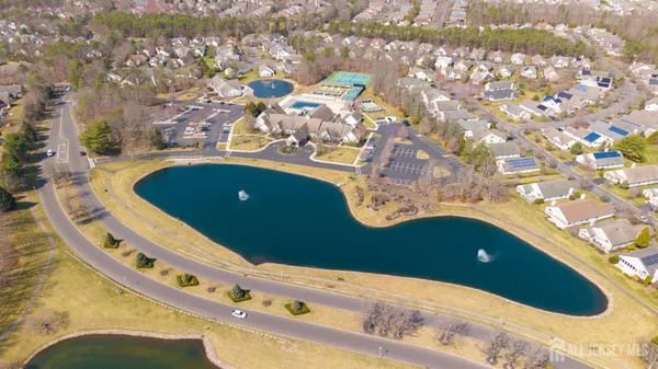 an aerial view of a house with swimming pool