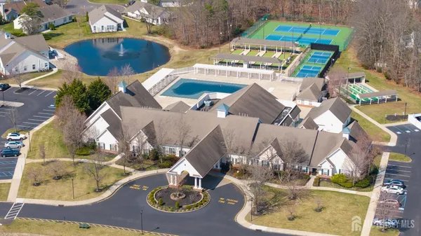 an aerial view of a house with backyard