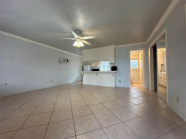 a view of a kitchen with a sink and a window