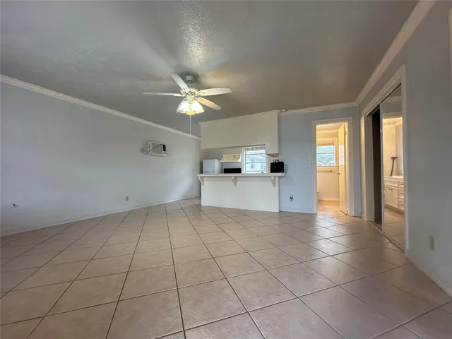 a view of a kitchen with a sink and a window