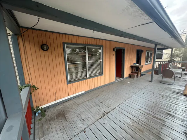 a view of a house with wooden floor and furniture