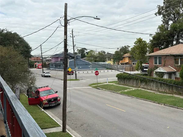 a view of street with parked cars