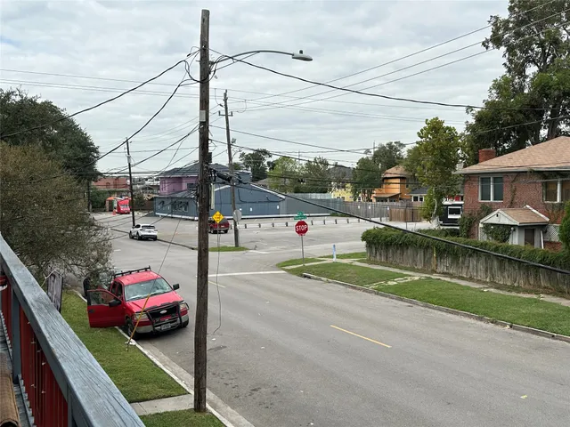 a view of street with parked cars