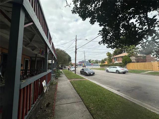 a view of a street with cars on the road