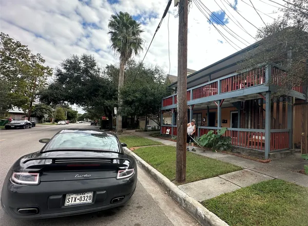 a view of a car parked in front of house