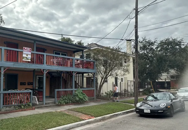 a view of a car park in front of house