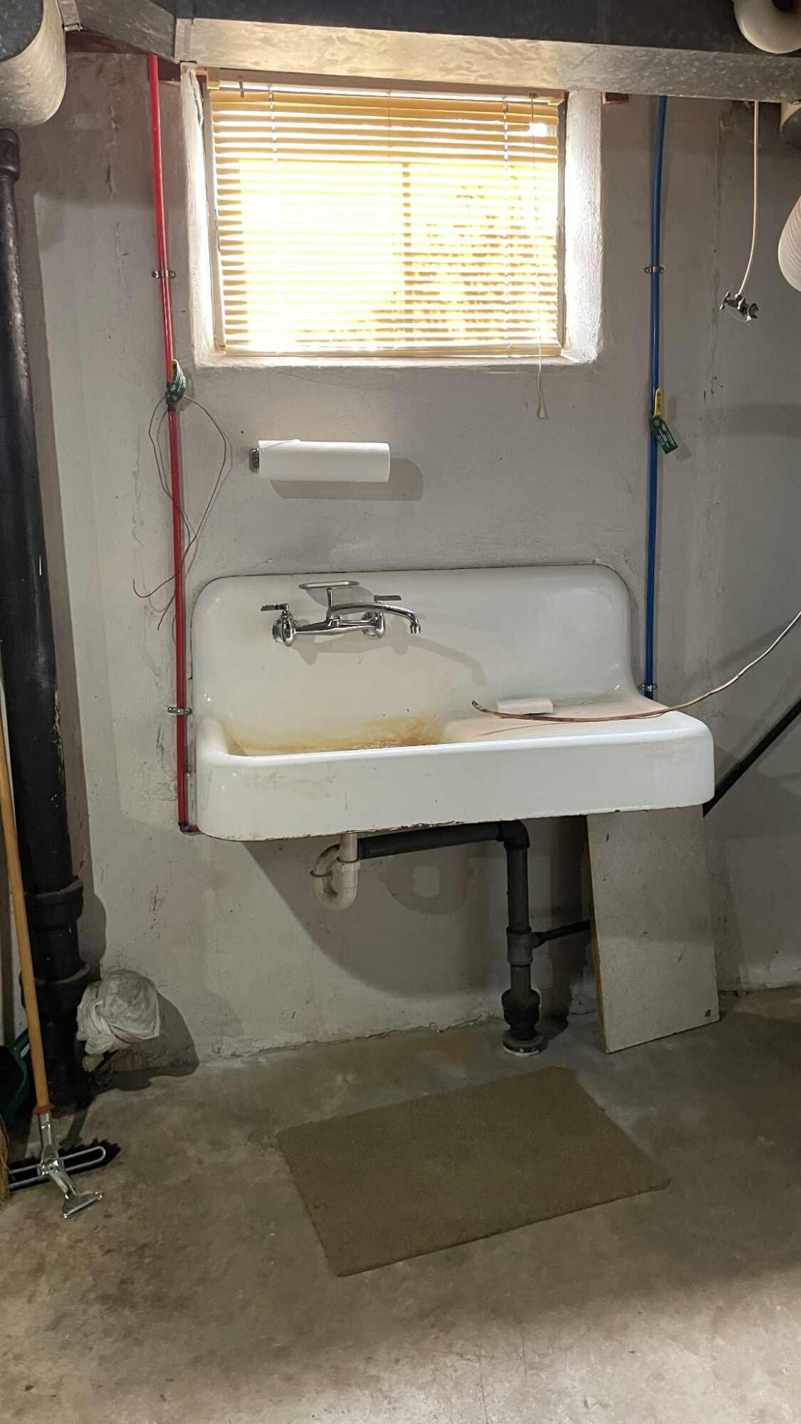 5980 Jordantown Road Vinton, VA 24179 - Photo 17 of 27 a bathroom with a sink and a window