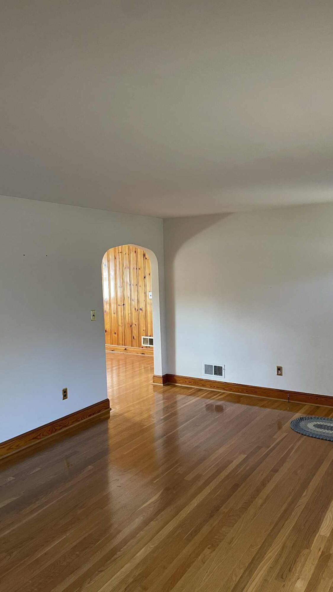 5980 Jordantown Road Vinton, VA 24179 - Photo 4 of 27 a view of empty room with wooden floor and fan