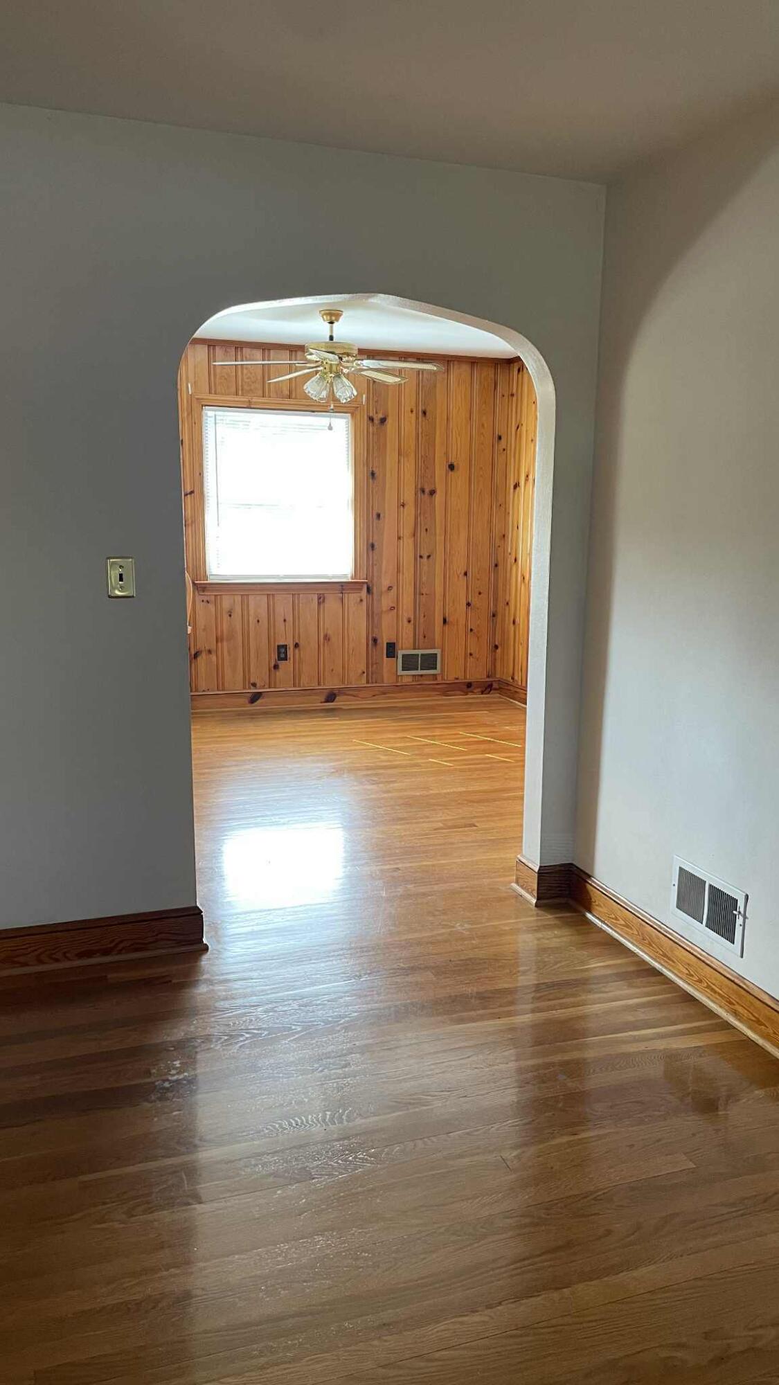 5980 Jordantown Road Vinton, VA 24179 - Photo 7 of 27 a view of an empty room with wooden floor and a window