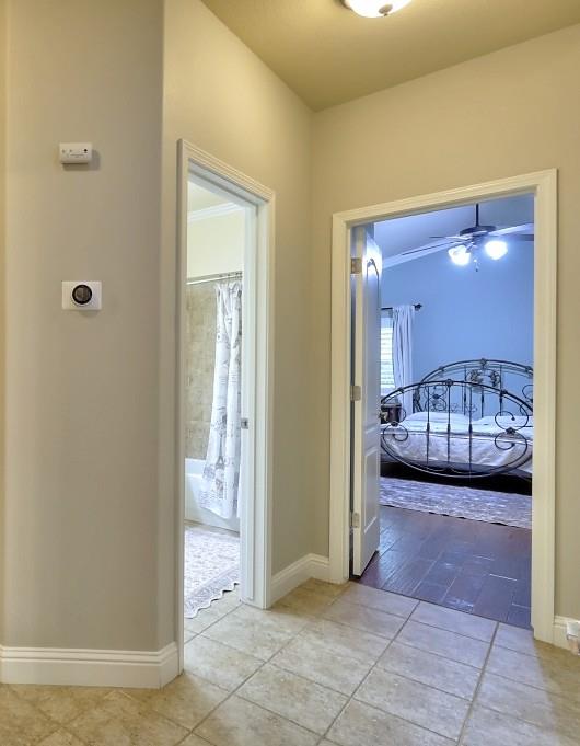 4152 Post Oak Drive Turlock, CA 95382 - Photo 50 of 71 a view of a hallway with a livingroom and a bathroom