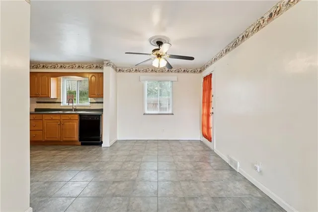 a view of a kitchen with a sink and a window