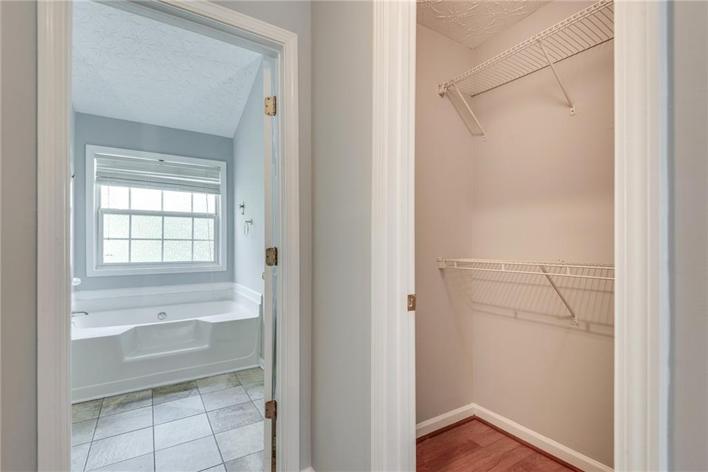 3337 Baymount Way Lawrenceville, GA 30043 - Photo 27 of 47 a bathroom with a bathtub and a shower