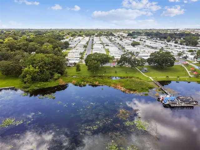 an aerial view of residential houses with city