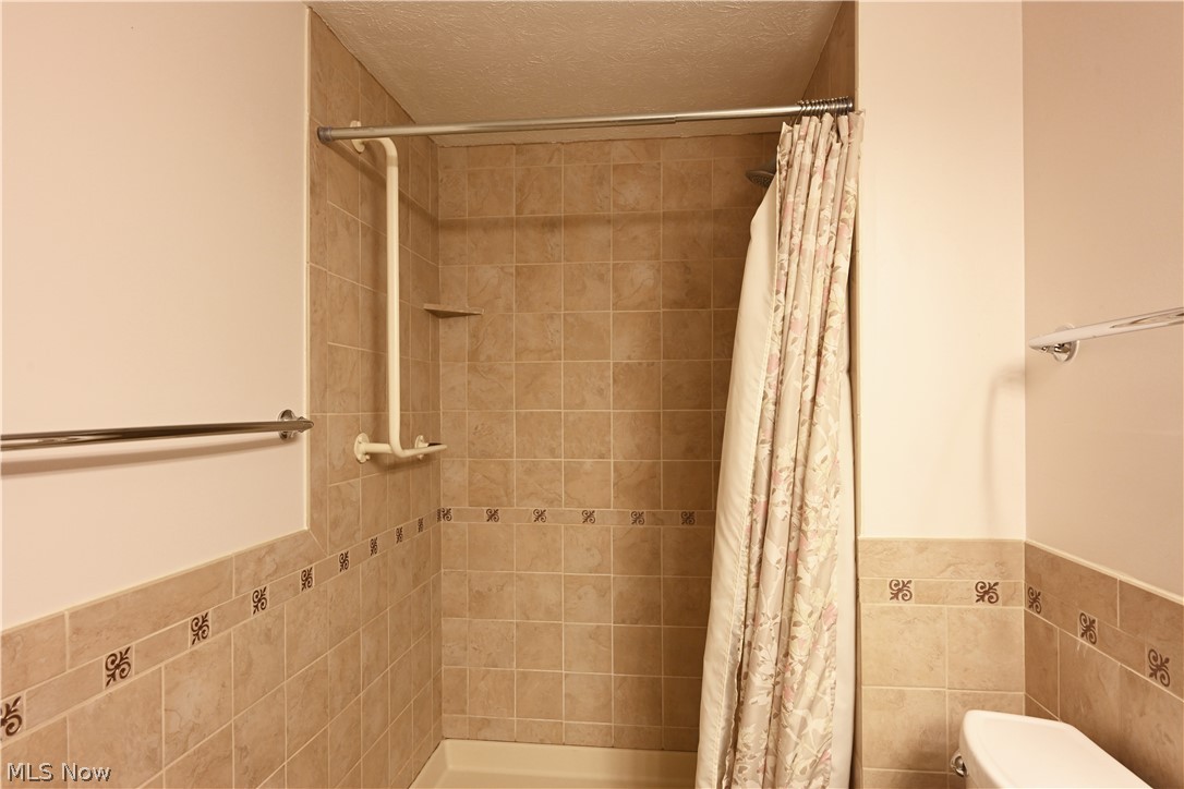 22962 Maple Ridge Road, Unit 108 North Olmsted, OH 44070 - Photo 23 of 37 Bathroom with toilet and a textured ceiling