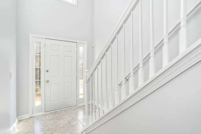 a view of staircase with white walls and white walls
