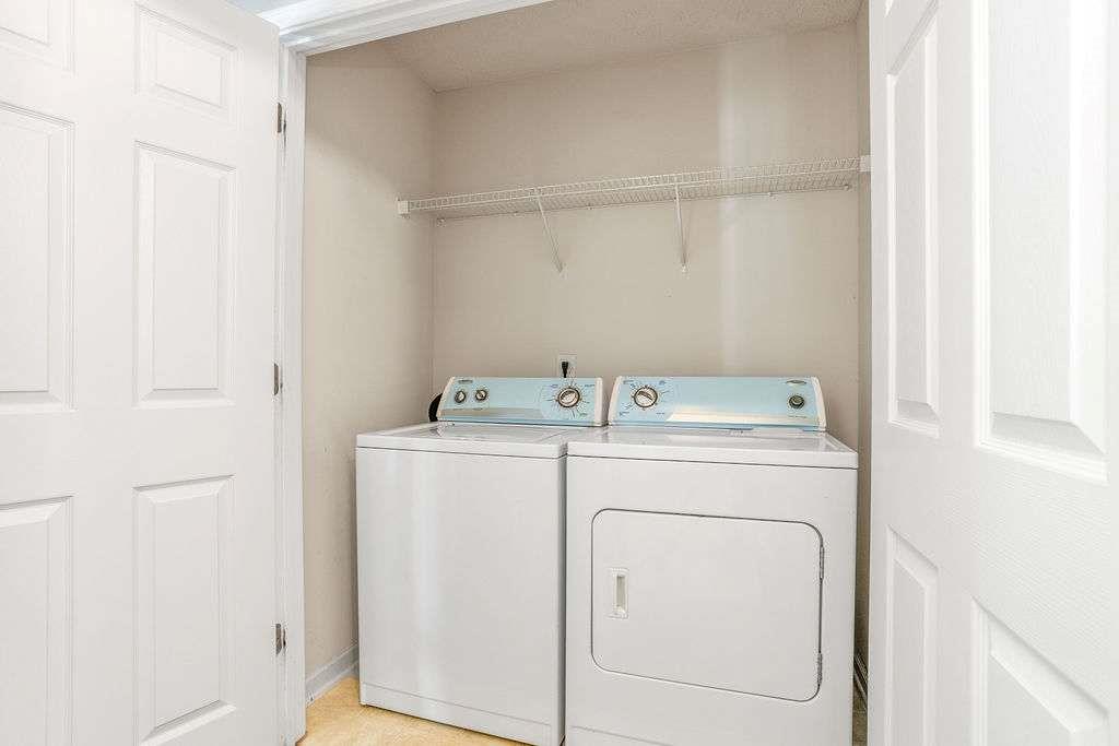 1461 Enchanted Forest Drive Conley, GA 30288 - Photo 43 of 47 a utility room with dryer and washer