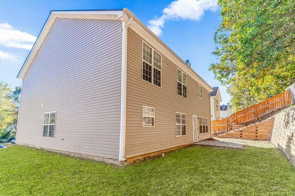 1461 Enchanted Forest Drive Conley, GA 30288 - Photo 44 of 47 a front view of a house with a yard