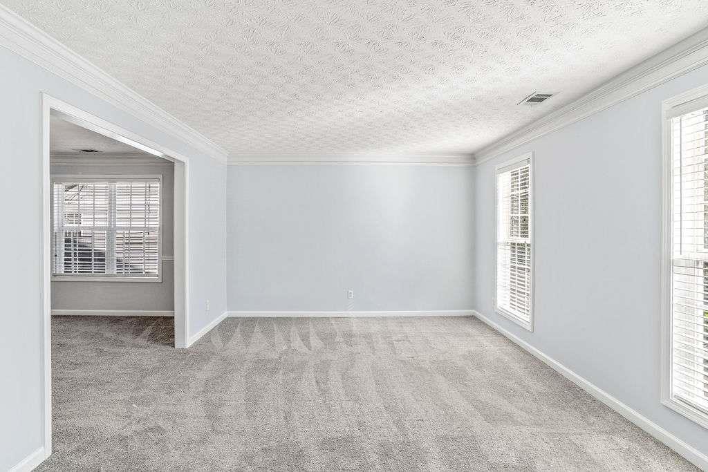 1461 Enchanted Forest Drive Conley, GA 30288 - Photo 5 of 47 an empty room with windows