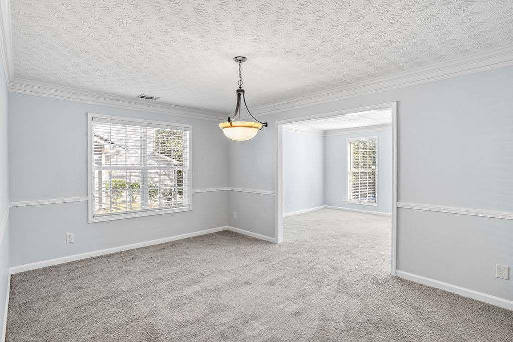 1461 Enchanted Forest Drive Conley, GA 30288 - Photo 7 of 47 a view of an empty room with a window
