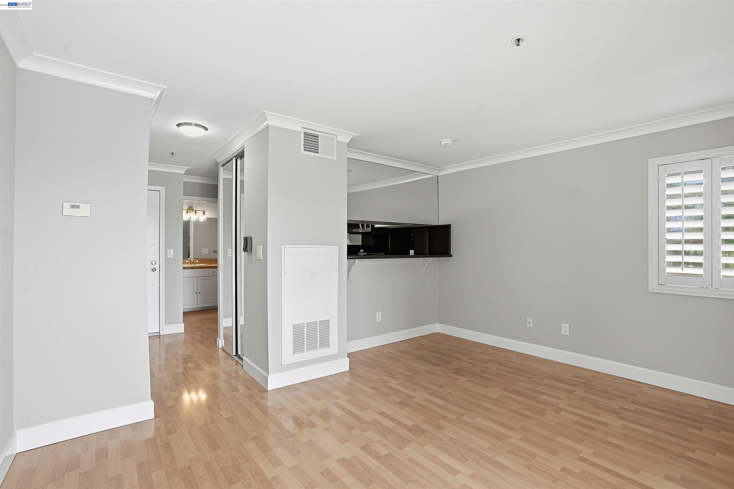 735 Watson Canyon Court, Unit 218 San Ramon, CA 94582 - Photo 8 of 18 a view of a hallway with wooden floor and a window
