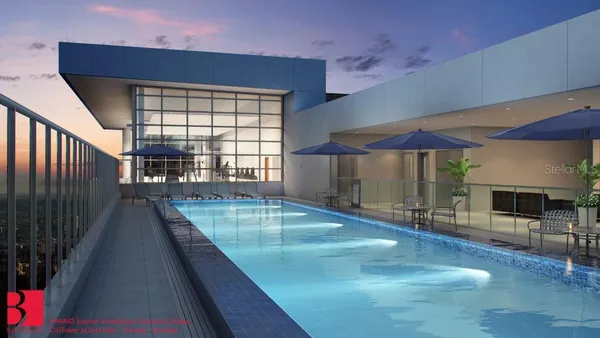 a swimming pool with outdoor seating