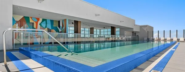 a view of balcony with deck and wooden floor
