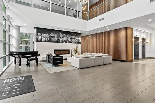 a living room with furniture and a fireplace