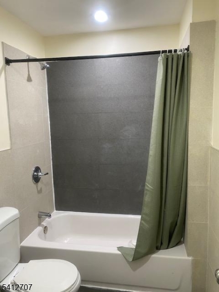 73 Ferry Street Newark, NJ 07105 - Photo 3 of 6 a bathroom with a shower and a toilet