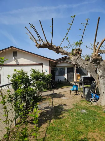 a view of a house with a yard