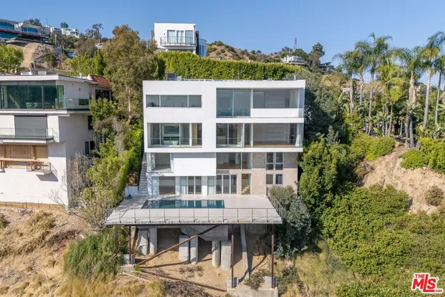 a view of a building with a garden