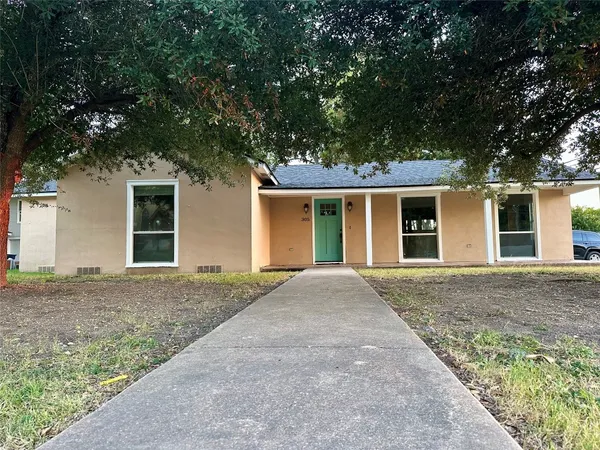 front view of a house with a dry yard