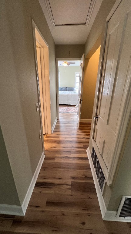 305 West Davilla Street Granger, TX 76530 - Photo 19 of 20 a view of a hallway with wooden floor and staircase