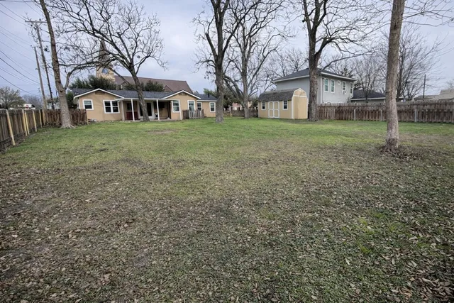 a view of house with yard
