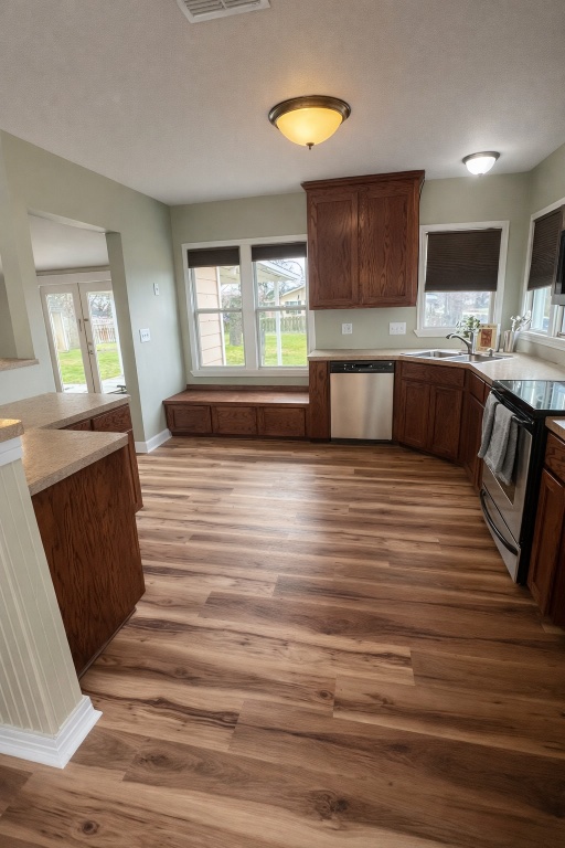 305 West Davilla Street Granger, TX 76530 - Photo 8 of 20 a kitchen with stainless steel appliances kitchen island granite countertop a stove a sink and a refrigerator