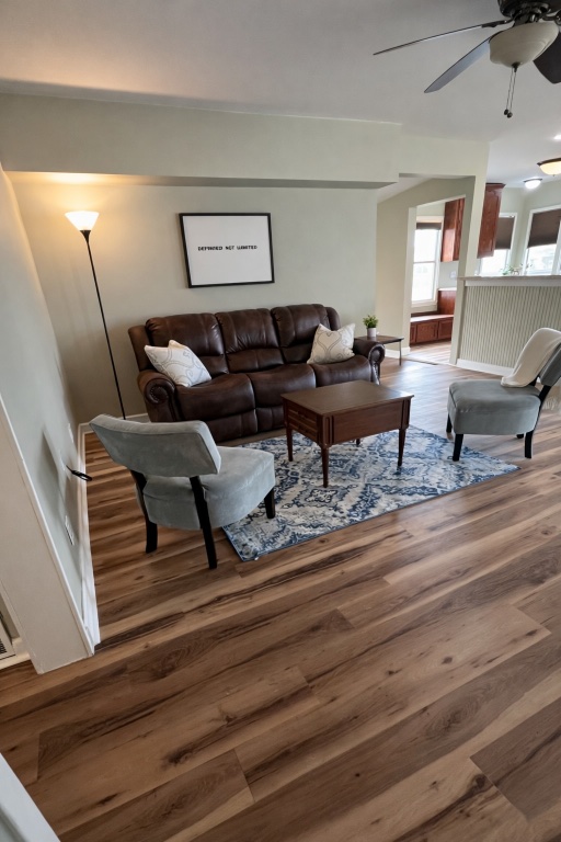 305 West Davilla Street Granger, TX 76530 - Photo 9 of 20 a living room with furniture and wooden floor
