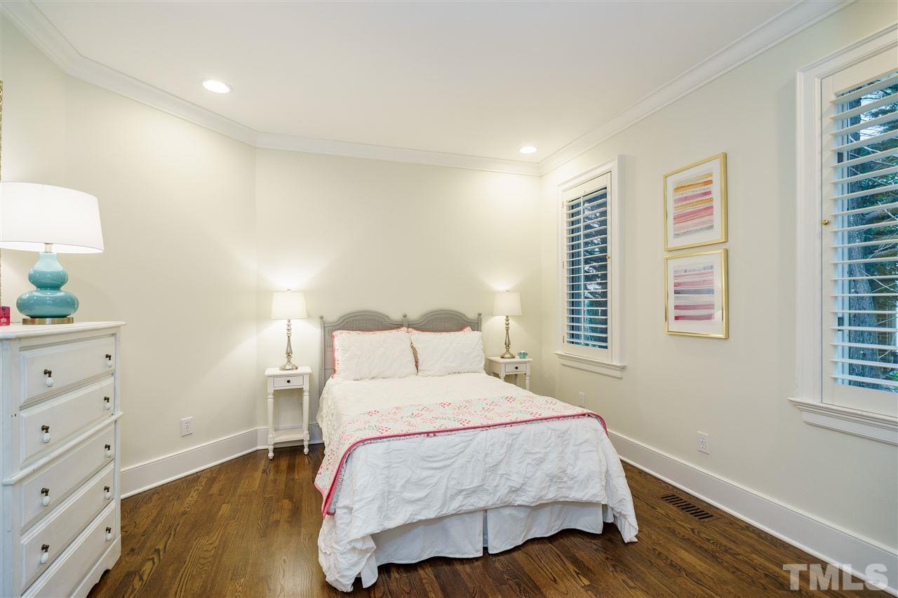 7628 Rainwater Road Raleigh, NC 27615 - Photo 12 of 25 a bedroom with a bed and a window