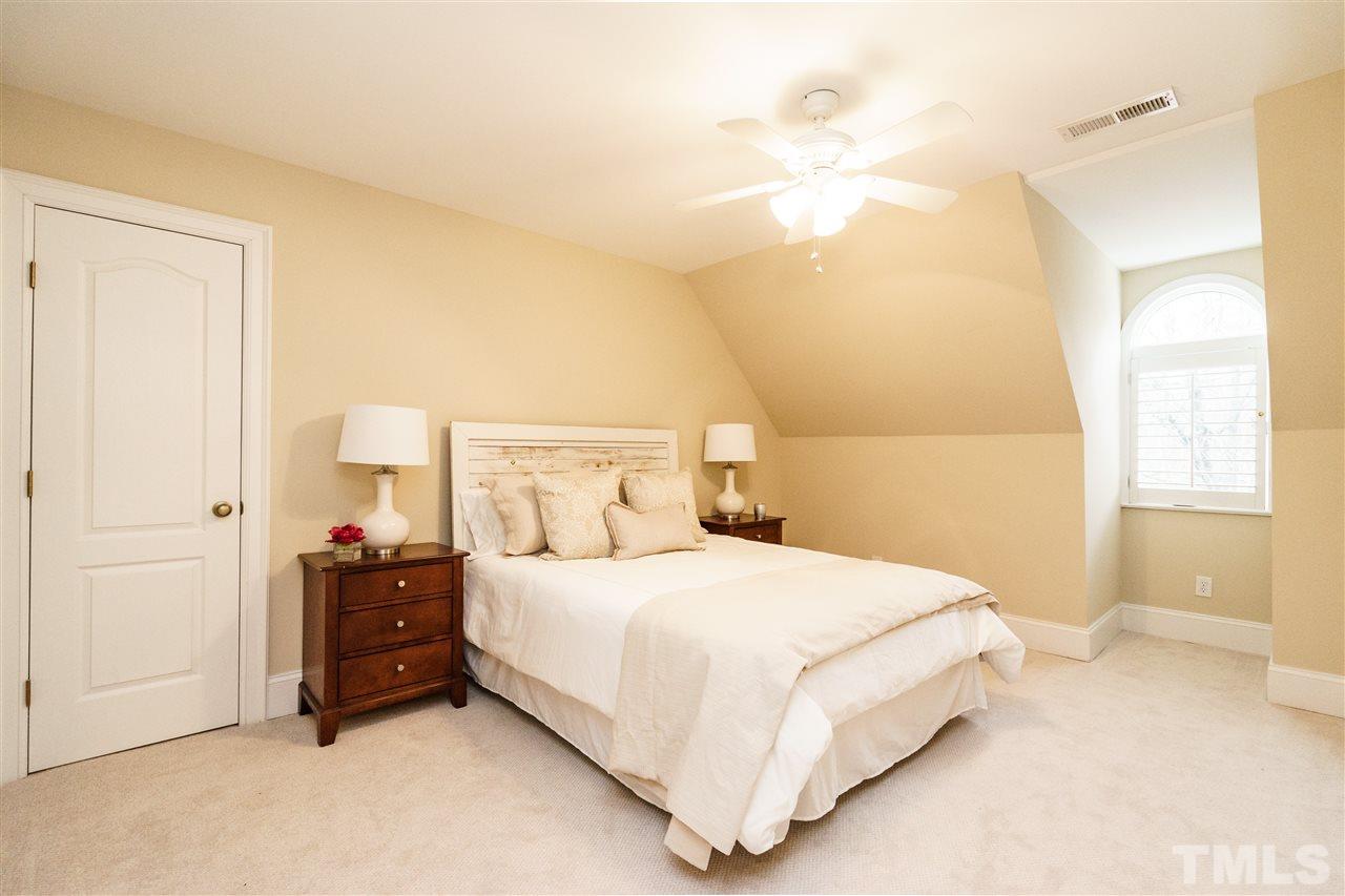 7628 Rainwater Road Raleigh, NC 27615 - Photo 19 of 25 a bedroom with a bed and a window