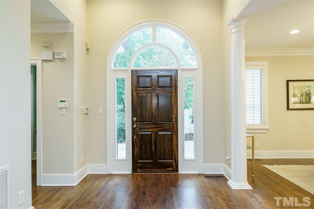 7628 Rainwater Road Raleigh, NC 27615 - Photo 3 of 25 an empty room with wooden floor closet and windows